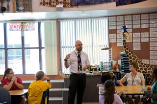 Ryan Dwyer, a full-time teacher and certified CCSD Librarian, teaches class at Kay Carl Elementary School, Friday May 13, 2016.