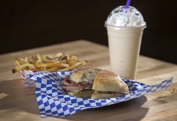 A Cubano sandwich with housemade Canadian bacon is shown with fries and a vanilla malt at Salted Malted Bakery & Creamery, 6584 N. Decatur Blvd., Tuesday, May 17, 2016. The restaurant offers many Canadian specialties such as poutine, peameal bacon, and a variety of sweets.