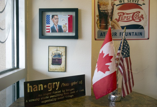 Canadian and American flags are displayed at Salted Malted Bakery & Creamery, 6584 N. Decatur Blvd., Tuesday, May 17, 2016. The restaurant offers many Canadian specialties such as poutine, peameal bacon, and a variety of sweets.