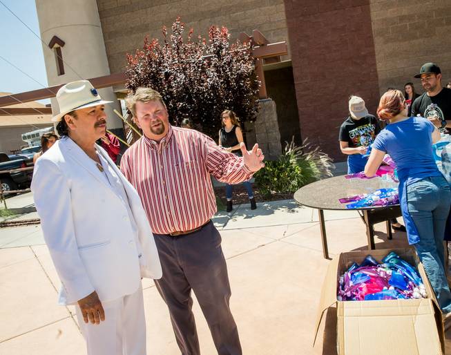 Carlos Santana, with John Fogal, visits and makes donations Monday, May 16, 2016, at Las Vegas Rescue Mission.