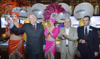Former Las Vegas Mayor Oscar Goodman, second from left, offers a toast during a 60th anniversary celebration for the Fremont hotel-casino at 200 Fremont St. in Las Vegas on Wednesday, May 18, 2016. Also on hand were Bill Boyd, executive chairman for Boyd Gaming, second from right, Jim Sullivan, general manager of the Fremont hotel-casino, and showgirls.
