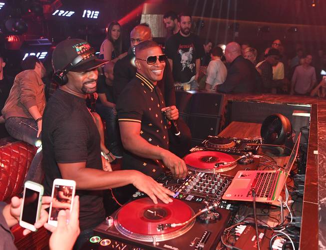 Jamie Foxx, right, with DJ Irie, hosts the grand opening ...