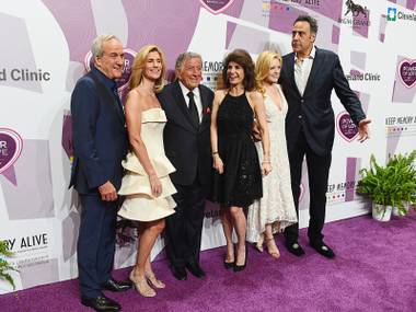 From left Co-Founder and Chairman of Keep Memory Alive Larry Ruvo, Susan Benedetto, honoree Tony Bennett, Co-Founder/Vice-Chairman of Keep Memory Alive Camille Ruvo, Isabella Quella and comedian Brad Garrett appear on the red carpet for Keep Memory Alive’s 20th Annual Power Of Love Gala at the MGM Grand Garden Arena on May 21, 2016, in Las Vegas.