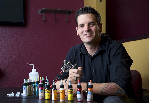 Jay Savage, tattoo artist and comic book illustrator, poses in Savage Ink Tattoo Emporium, 3650 S. Decatur Blvd., Monday, May 23, 2016.