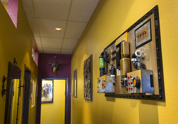 Artwork is shown in a hallway in Savage Ink Tattoo Emporium, 3650 S. Decatur Blvd., Monday, May 23, 2016.
