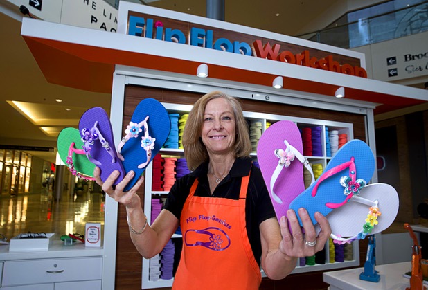 Shaunna Fisk, regional manager for Flip Flop Workshop, poses at the Fashion Show mall kiosk location Monday, May 23, 2016. The company allows you to decorate your flip-flops, then watch a "flip-flop genius" put it together in front of you.