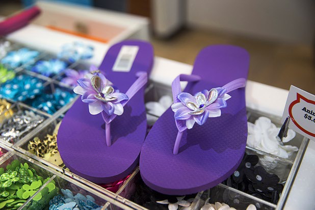 Customized flip flops are displayed at the Flip Flop Workshop kiosk in the Fashion Show mall Monday, May 23, 2016. The company allows you to decorate your flip-flops, then watch a "flip-flop genius" put it together in front of you.