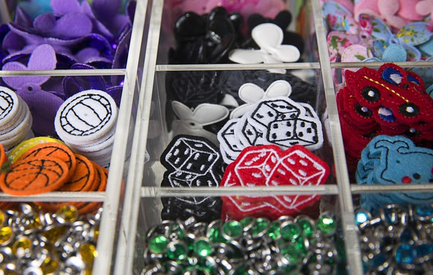 Decorations for customized flip flops are displayed at the Flip Flop Workshop kiosk in the Fashion Show mall Monday, May 23, 2016. The company allows you to decorate your flip-flops, then watch a "flip-flop genius" put it together in front of you.