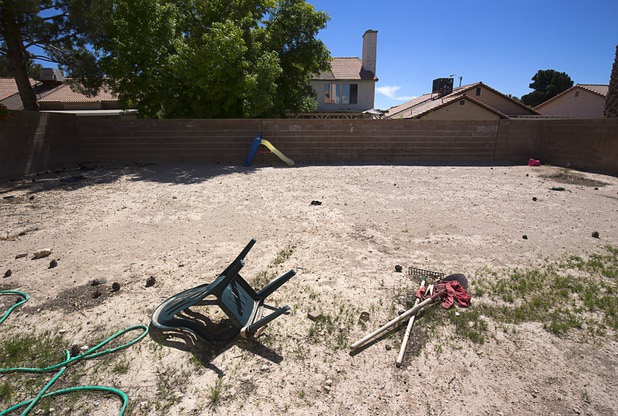 The backyard of a vacant home is shown in North Las Vegas Wednesday, May 18, 2016. The home had been occupied by squatters, police said.