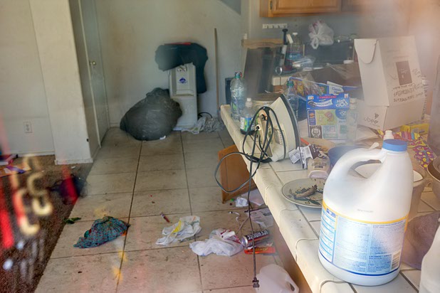 A view through a window of a vacant home that had been occupied by squatters Wednesday, May 18, 2016, in North Las Vegas.