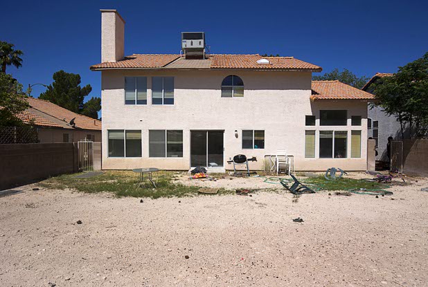 The backyard of a vacant home is shown in North Las Vegas Wednesday, May 18, 2016. The home had been occupied by squatters, police said.