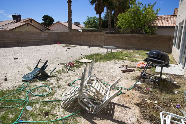 The backyard of a vacant home is shown in North Las Vegas Wednesday, May 18, 2016. The home had been occupied by squatters, police said.