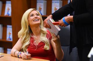 Holly Madison smiles during a book signing to promote her new book 