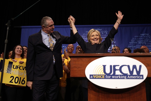 Democratic U.S. presidential candidate Hillary Clinton poses with United Food & Commercial Workers International President Marc Perrone after speaking to the attendees of the UFCW convention at the Mirage, Thursday, May 26, 2016.