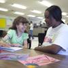 Floor supervisor Katrina Campbell works with a client during an Adult Day Service class for individuals with disabilities at Easter Seals Nevada.