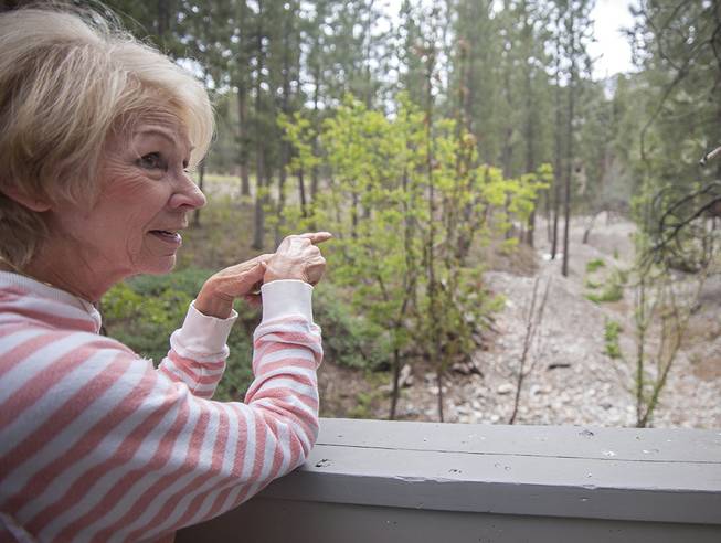 Becky Grismanauskas stands outside her Mount Charleston home on Friday, May 27, 2016, as she describes a flood that hit the area several years earlier. Becky and her husband, Duffy, are moving to Henderson after 27 years spent living on the mountain.

