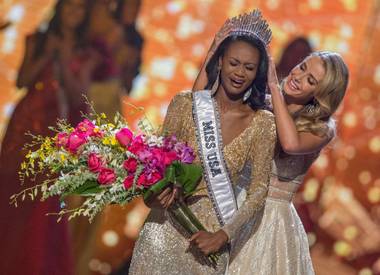 Miss District of Columbia Deshauna Barber is crowned Miss USA during the Miss USA Pageant at T-Mobile Arena on Sunday, June 5, 2016, on the Las Vegas Strip. 2015 Miss USA Olivia Jordan is at right.