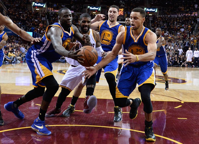 The Golden State Warriors’ Draymond Green, Cleveland Cavaliers’ Kyrie Irving and Warriors’ Klay Thompson and Stephen Curry pursue a loose ball Friday, June 10, 2016, during the second half of Game 4 in the NBA Finals in Cleveland. Golden State won 108-97.