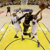 Cleveland Cavaliers forward LeBron James, center, shoots against the Golden State Warriors on Sunday, June 19, 2016, during the first half of Game 7 of the NBA Finals in Oakland, Calif.