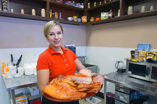 Zoya Medov shows off a platter of smoked bacon at Tina's Gourmet Sausage House, 2101 S Decatur Blvd., Thursday, June 16, 2016.