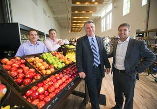 Raintree Investment executives pose during the official opening of the Seasons Market at Lake Las Vegas in Henderson Tuesday, June 21, 2016. From left: Jeff Anderson, excutive vice president, Doug McPhail, Seasons Market general manager, Patrick Parker, president, and Cody Winterton, executive vice president. The neighborhood grocery store and specialty market is located in MonteLago Village.