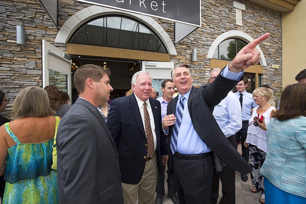 Cody Winterton, left, Raintree Investments executive vice president, Jerry Mansfield, center, a Henderson planning commissioner, and Patrick Parker, Raintree Investments president, chat during the official opening of the Seasons Market at Lake Las Vegas in Henderson Tuesday, June 21, 2016. The neighborhood grocery store and specialty market is located in MonteLago Village.