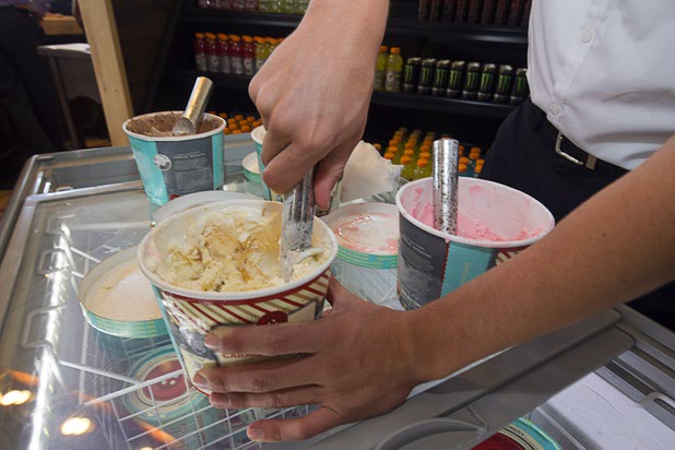 Jacob Lescenski serves ice cream from the Utah-based Red Button Vintage Creamery during the official opening of the Seasons Market at Lake Las Vegas in Henderson Tuesday, June 21, 2016. The neighborhood grocery store and specialty market is located in MonteLago Village.