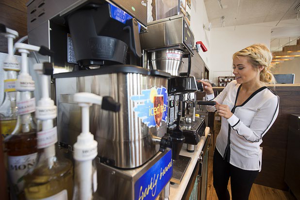 Barista Kami Deike makes an expresso during the official opening of the Seasons Market at Lake Las Vegas in Henderson Tuesday, June 21, 2016. The neighborhood grocery store and specialty market is located in MonteLago Village.