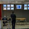 A man watches the screens at a William Hill gambling shop in London, June 20, 2016. As Britain goes to the polls to determine whether to leave the European Union, bookmakers are anticipating record-setting gambling on the outcome. 