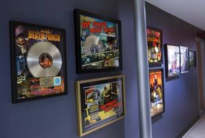Awards for records produced by Kane Churko are displayed in a hallway at The Hideout Recording Studio in Henderson Tuesday, June 28, 2016.