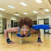 Pediatrician Trina Wiggins, 55, practices a leg-over-arm pushup in preparation for a Ms. Fitness competition while training at her local YMCA in Las Vegas June 24, 2016.