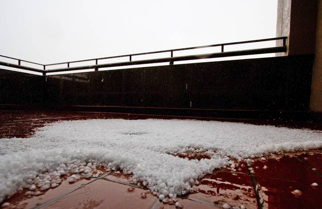 Hail accumulates on an outdoor patio in Henderson as a storm passes through the Las Vegas Valley Thursday, June 30, 2016. Golf-ball-size hail stones were reported in Henderson, according to the National Weather Service.