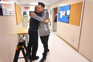 Frankie Moreno gets a hug from a crew member before taking to the stage for the closing night of his 