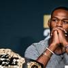 UFC 200 fighter Jon Jones ponders his opponent Daniel Cormier during a reporter's question at a news conference and face-off for the final time at the MGM Grand on Wednesday, July 6, 2016.