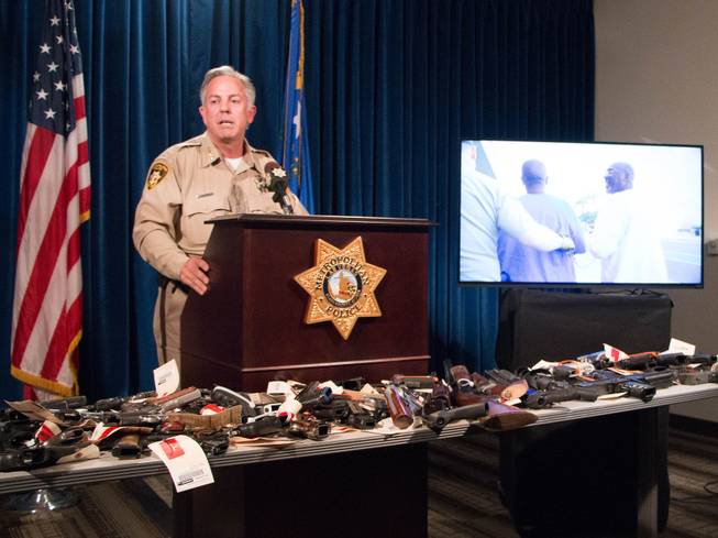 Clark County Sheriff Joe Lombardo appears with confiscated firearms at a news conference Wednesday, July 6, 2016, addressing violent crime in Las Vegas.