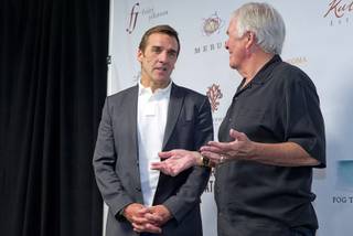 George McPhee, left , speaks with Bill Foley, the owner of Las Vegas' NHL expansion team, after McPhee was announced as general manager of the expansion team during a news conference at the T-Mobile Arena Wednesday, July 13, 2016. McPhee is a former general manager of the NHL's Washington Capitals.