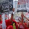 Striking workers from New Jersey's Trump Taj Mahal casino join supporters of Local 54 from the Unite-HERE union to protest outside the Fifth Avenue office of Carl Icahn, Wednesday, July 13, 2016, in New York.