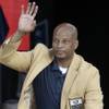 Former NFL football player Ronnie Lott is introduced during the induction ceremony at the Pro Football Hall of Fame Saturday, Aug. 3, 2013, in Canton, Ohio.