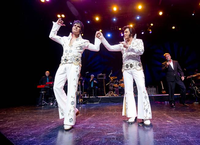 Winner Ted Torres, left, celebrates with second place finisher Dwight Icenhower during an Elvis Presley tribute artist contest, part of Images of the King: Las Vegas, an Elvis Festival, at Sam's Town Sunday, July 17, 2016. Torres took home $5,000 in prize money with the win.