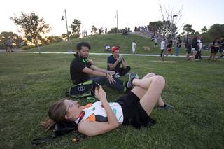 Emily Kray, foreground, looks for Pokemon with friends during a Pokemon Go event at Craig Ranch Regional Park in North Las Vegas Sunday, July 17, 2016. About 1,500 people attended the event according to the Pokemon Go Las Vegas Facebook page.