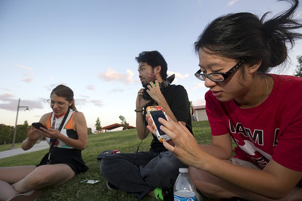Emily Kray, left, Trung Hua, and Elise Nguyen look for Pokemon during a Pokemon Go event at Craig Ranch Regional Park in North Las Vegas Sunday, July 17, 2016. About 1,500 people attended the event according to the Pokemon Go Las Vegas Facebook page.