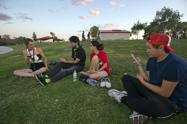 Emily Kray, left, Trung Hua, Elise Nguyen, and Tom Nguyen (no relation) look for Pokemon during a Pokemon Go event at Craig Ranch Regional Park in North Las Vegas Sunday, July 17, 2016. About 1,500 people attended the event according to the Pokemon Go Las Vegas Facebook page.