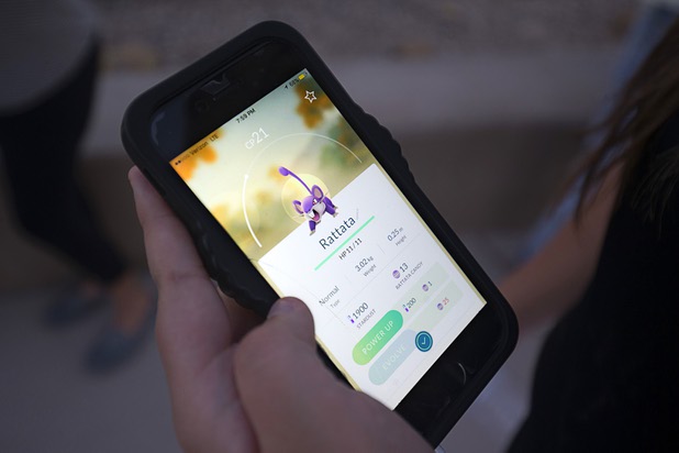 A Pokemon player catches a Rattata during a Pokemon Go event at Craig Ranch Regional Park in North Las Vegas Sunday, July 17, 2016. About 1,500 people attended the event according to the Pokemon Go Las Vegas Facebook page.