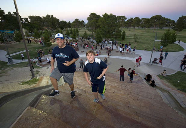 Raymon Brown and his son Marcellus, 12, look for Pokemon during a Pokemon Go event at Craig Ranch Regional Park in North Las Vegas Sunday, July 17, 2016. About 1,500 people attended the event according to the Pokemon Go Las Vegas Facebook page.