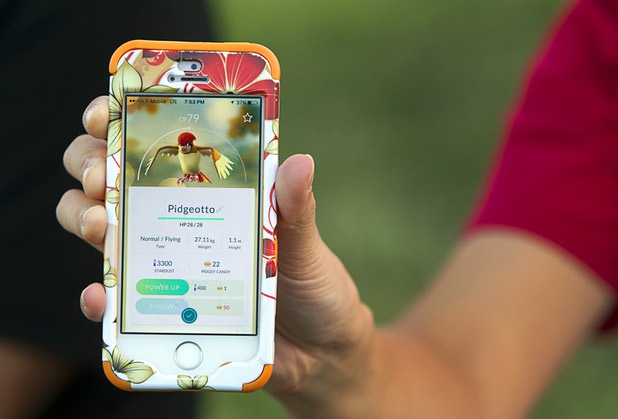 Betty Nguyen shows off a captured Pokemon during a Pokemon Go event at Craig Ranch Regional Park in North Las Vegas Sunday, July 17, 2016. About 1,500 people attended the event according to the Pokemon Go Las Vegas Facebook page.