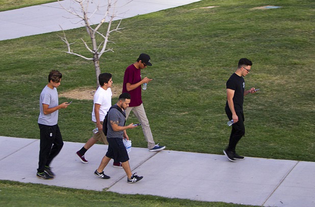 Players look for Pokemon during a Pokemon Go event at Craig Ranch Regional Park in North Las Vegas Sunday, July 17, 2016. About 1,500 people attended the event according to the Pokemon Go Las Vegas Facebook page.