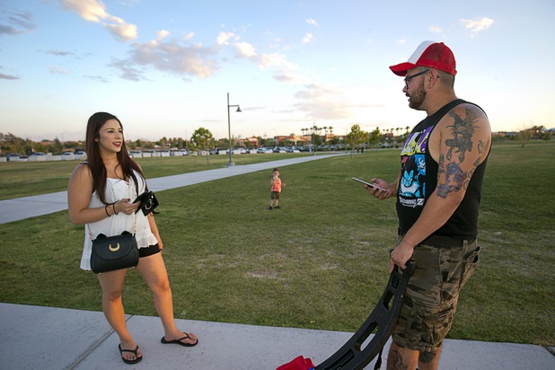 Bianca and Carlos Cuadra look for Pokemon during a Pokemon Go event at Craig Ranch Regional Park in North Las Vegas Sunday, July 17, 2016. About 1,500 people attended the event according to the Pokemon Go Las Vegas Facebook page.