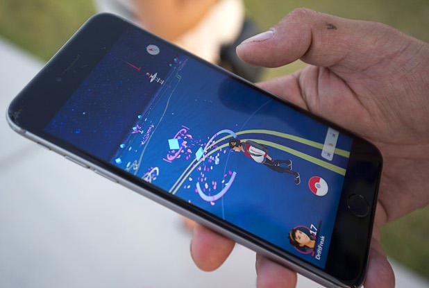 A player looks for Pokemon during a Pokemon Go event at Craig Ranch Regional Park in North Las Vegas Sunday, July 17, 2016. About 1,500 people attended the event according to the Pokemon Go Las Vegas Facebook page.