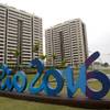 The Rio 2016 sign stands in front of the Olympic Village during a media tour in Rio de Janeiro, Brazil, Thursday, June 23, 2016. 