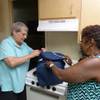 Client Judith Cran and senior companion Rosalind Robinson packing for the day's activities.